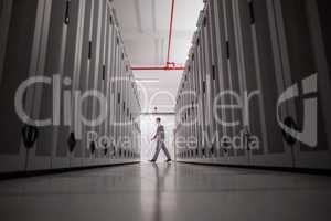 Technician walking in server hallway