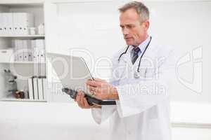 Doctor using his laptop