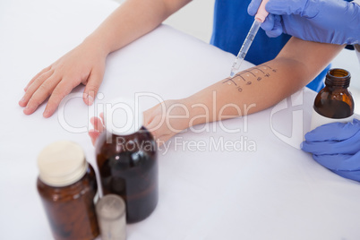 Doctor performing a skin prick test