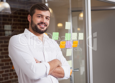 Casual businessman smiling at camera