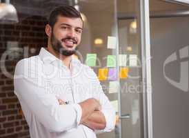 Casual businessman smiling at camera