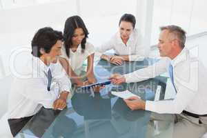 Business team looking at a tablet