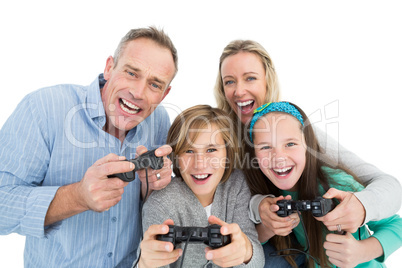 Happy family with two children playing video games