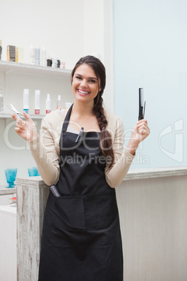 Cheerful hairdresser looking at camera