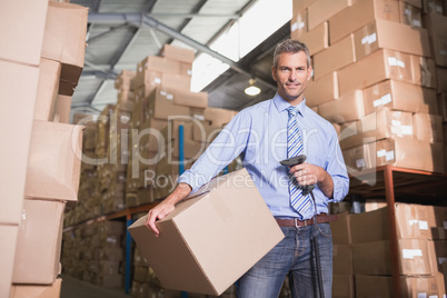 Manager scanning package in warehouse