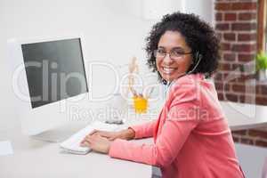 Casual businesswoman working on computer