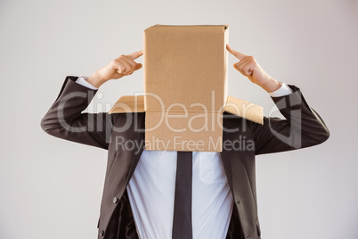 Anonymous businessman pointing to box