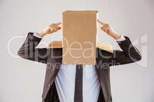 Anonymous businessman pointing to box