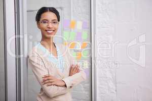 Businesswoman wearing glasses and smiling at camera