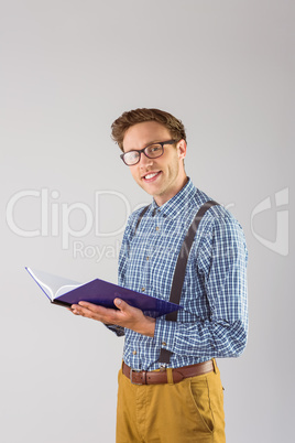 Geeky student reading a book
