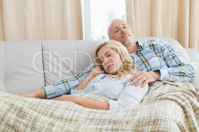 Happy couple relaxing on the couch