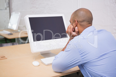 Businessman using computer at desk