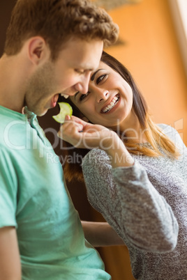 Cute couple preparing food together Cute couple preparing food together