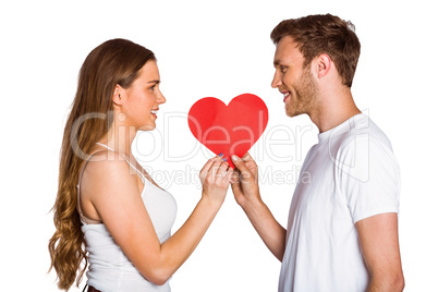 Romantic young couple holding heart
