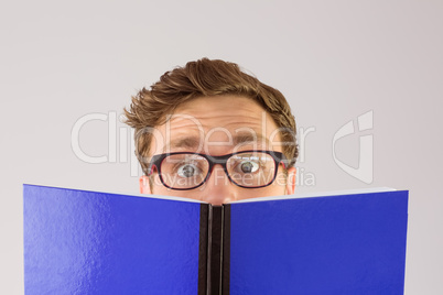 Geeky student reading a book