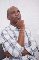 Portrait of a man thinking at his desk