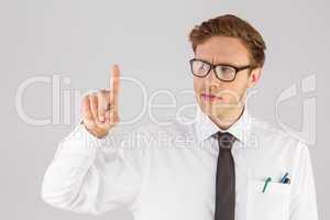 Geeky businessman smiling and pointing