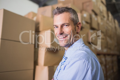 Smiling male manager in warehouse