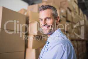 Smiling male manager in warehouse