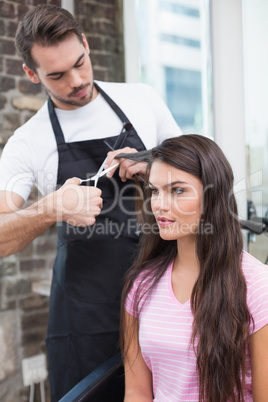 Pretty brunette getting her hair cut