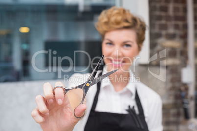 Confident hairdresser smiling at camera