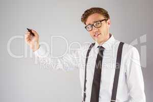 Geeky businessman writing with marker