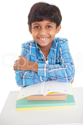 Cute elementary pupil smiling at camera