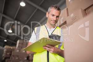 Warehouse worker with clipboard