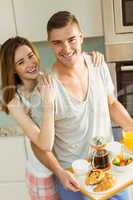 Cute couple preparing their breakfast