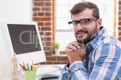 Casual businessman smiling at camera