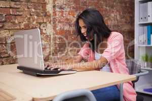 Angry woman shouting at her laptop