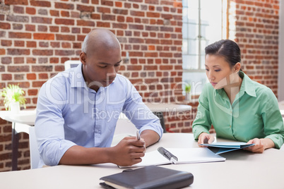 Casual business team working together at desk