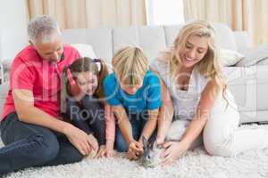 Happy family with pet bunny