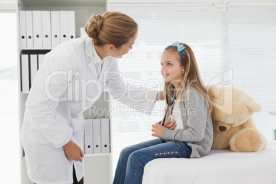 Doctor giving a patient a stuffed bear