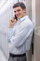 Portrait of a smiling technician on the phone
