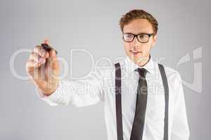 Geeky businessman writing with marker