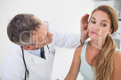 Doctor examining patients face