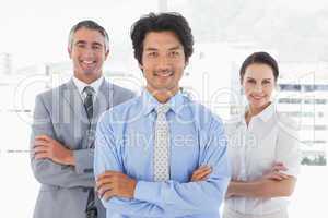 Businessman standing with work colleagues