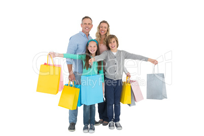 Portrait of smiling family with shopping bag