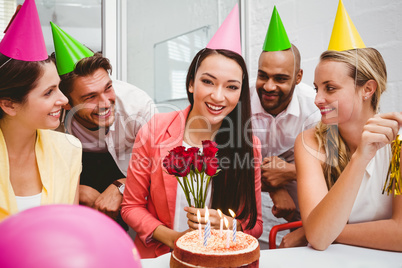 Casual business team celebrating a birthday