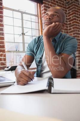 Casual businessman working at his desk