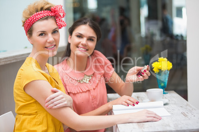 Pretty friends having a coffee Pretty friends having a coffee