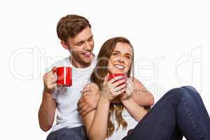 Cheerful couple with coffee cups