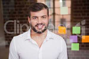 Casual businessman smiling at camera