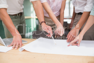 Architecture team working together at desk