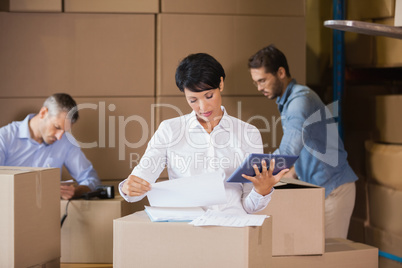 People at work in warehouse