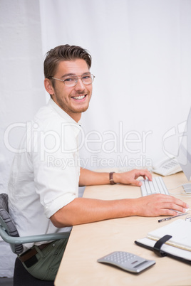 Businessman with computer at office desk