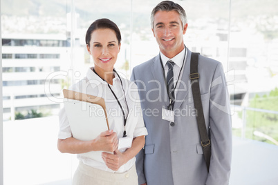 Businessman standing with co worker
