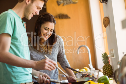 Cute couple preparing food together