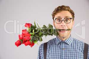 Geeky hipster biting a bunch of roses